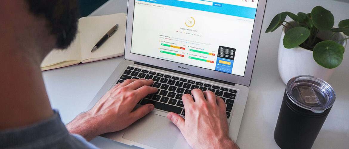 a man working on a laptop with the screen showing technical SEO tools