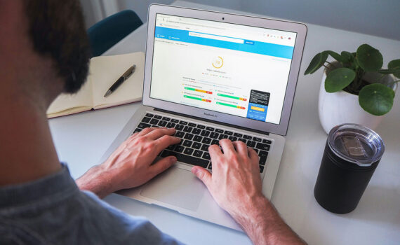 a man working on a laptop with the screen showing technical SEO tools